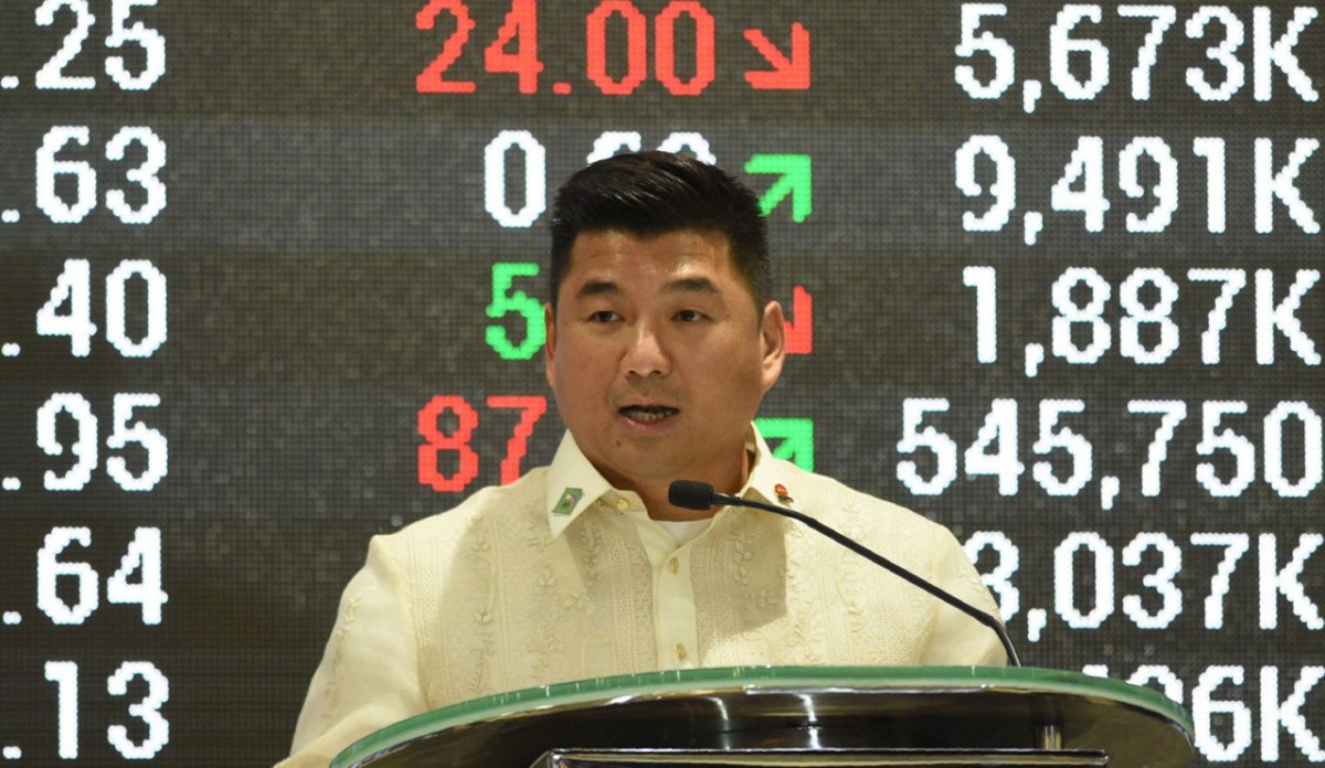 Dennis Uy, chairman and CEO of Philippines' Phoenix petroleum company, delivers his spech at the Philippine Stock Exchange in the financial district of Makati, suburban Manila on July 11, 2017, on the company's tenth anniversary of its listing.  Ted Aljib
