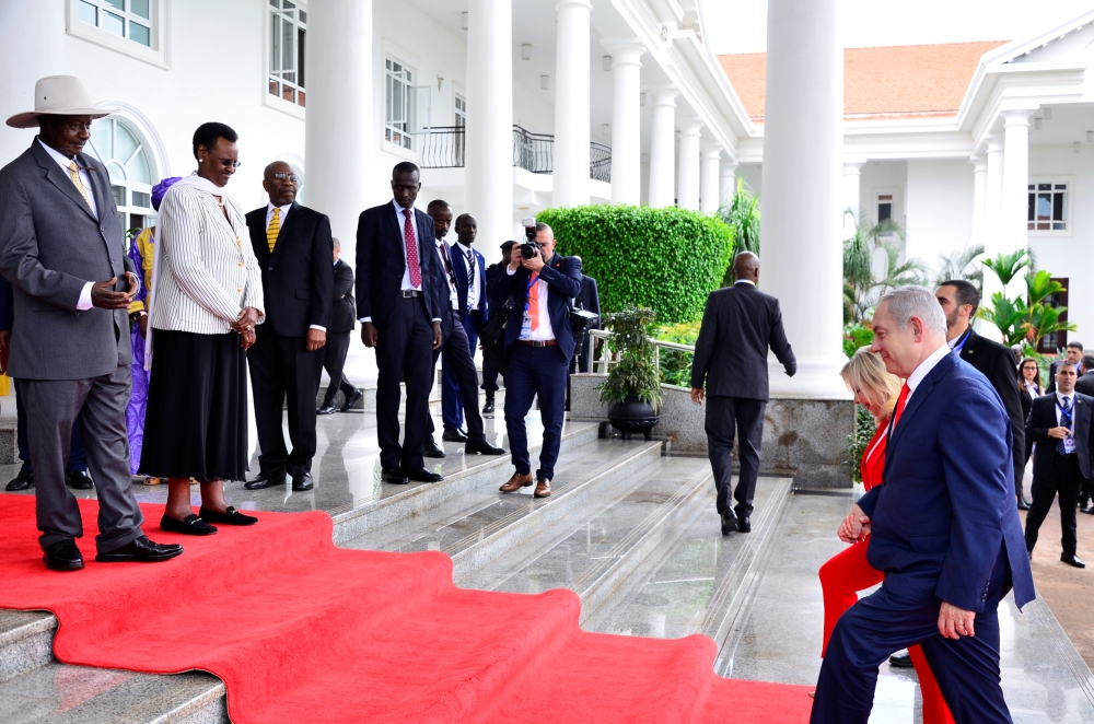 Israeli Prime Minister Benjamin Netanyahu (R) and his wife Sara Netanyahu arrive to meet Ugandan President Yoweri Museveni and Uganda's First Lady Janet Museveni at State House in Entebbe, Uganda February 3, 2020. REUTERS/Abubaker Lubowa 