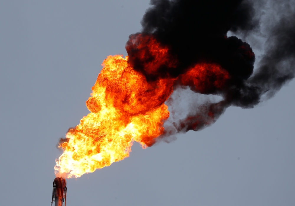 A flame burning natural gas is seen at the Joint stock company Mozyr oil refinery near the town of Mozyr, Belarus, January 4, 2020. Reuters / Vasily Fedosenko