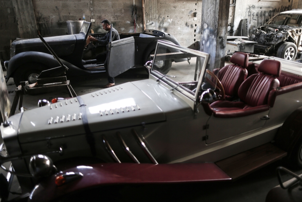 Representative image (Munir Shindy, a 40-year-old Palestinian who restores old cars as a hobby, works on vintage cars at his workshop in Gaza City on October 28, 2019. AFP / Mahmud Hams