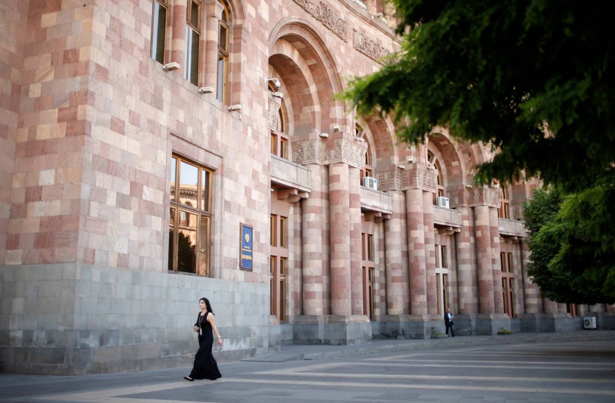 A woman walks in front of the government headquarters at the Republic square in Yerevan, Armenia, May 3, 2018. Reuters/David Mdzinarishvili