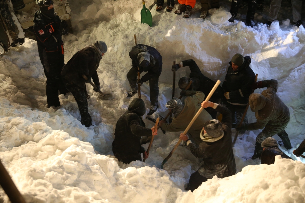 Search and rescue works continue at site to find a construction equipment and a van, which have been buried under avalanche with passengers, at Van-Bahcesaray highway in Van, Turkey on February 4, 2020. (Özkan Bilgin / Anadolu Agency)
 