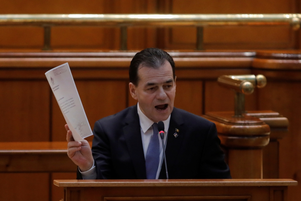 Romanian interim PM Ludovic Orban delivers a speech before a no-confidence vote session in Parliament in Bucharest, Romania February 5, 2020. Inquam Photos/George Calin via Reuters
