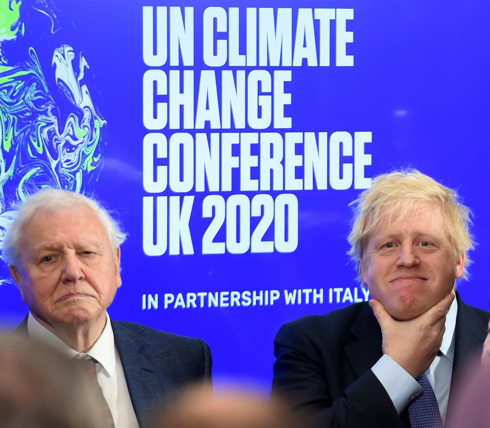 Britain's Prime Minister Boris Johnson (R) and British broadcaster and conservationist David Attenborough attend an event to launch the United Nations' Climate Change conference, COP26, in central London on February 4, 2020.  AFP / Jeremy Selwyn 