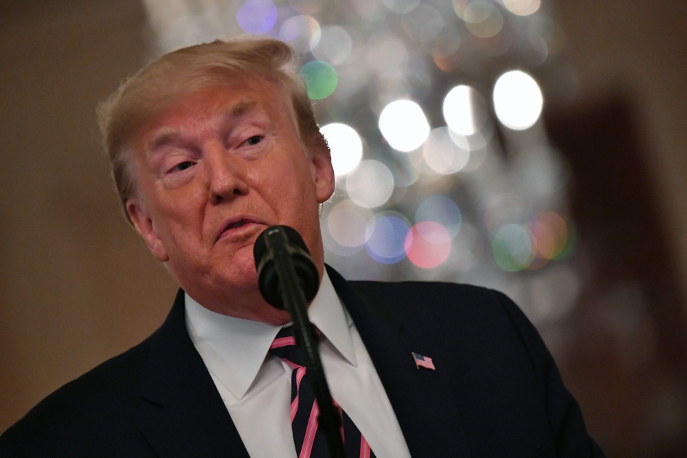 US President Donald Trump speaks about his Senate impeachment trial in the East Room of the White House in Washington, DC, February 6, 2020. AFP / Nicholas Kamm
