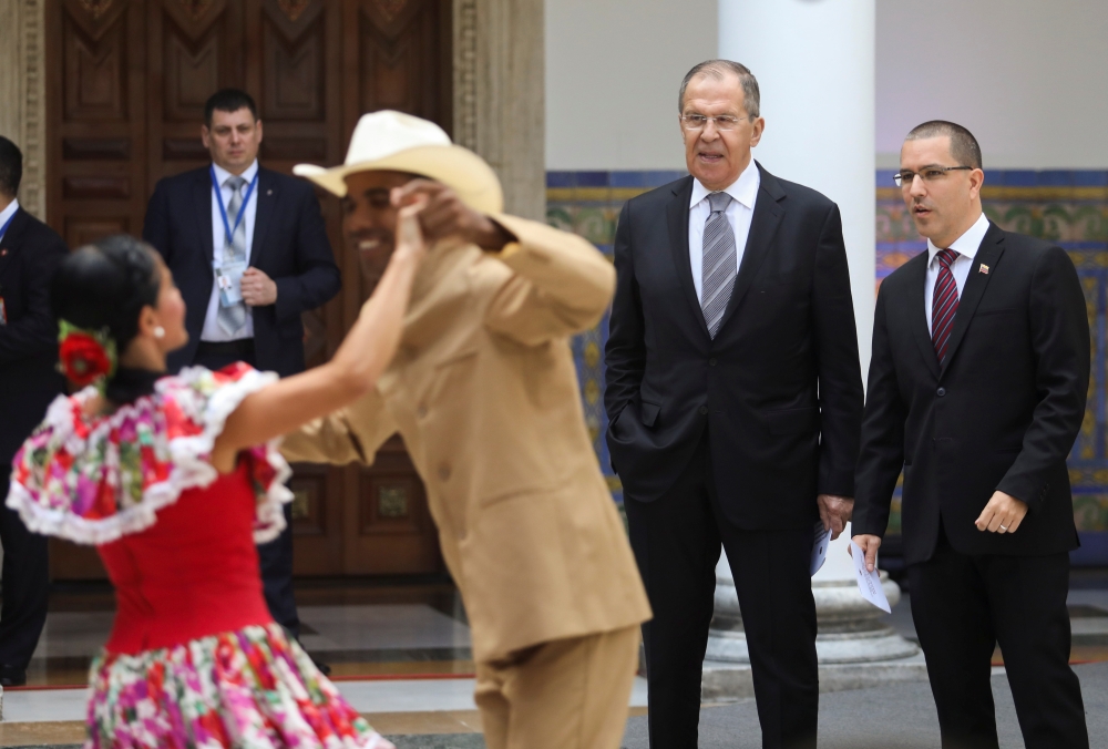 Russia's Foreign Minister Sergey Lavrov and his Venezuelan counterpart Jorge Arreaza watch couples dance to folkloric music as they arrive for a meeting in Caracas, Venezuela February 7, 2020. Reuters/Fausto Torrealba