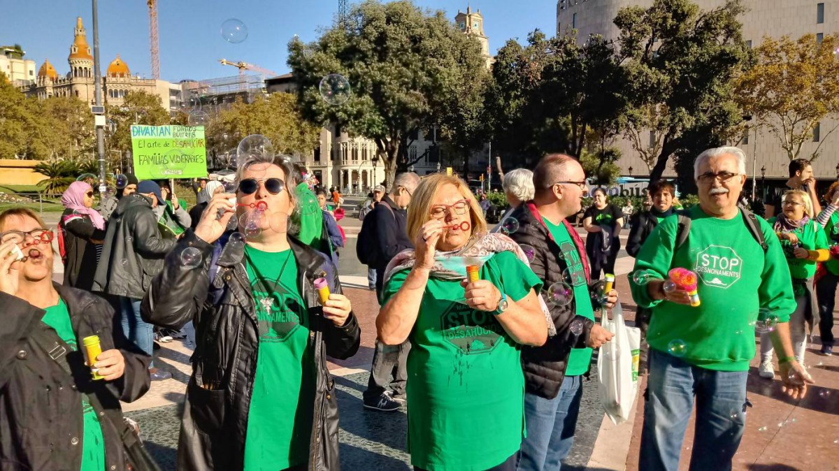 Members of Spain's Mortgage Victims' Platform (PAH) blow bubbles at an event in Barcelona, to symbolise Spain's 'property bubble' and fight rising rental prices on November 6, 2019. Handout picture courtesy of: Mortgage Victims' Platform 