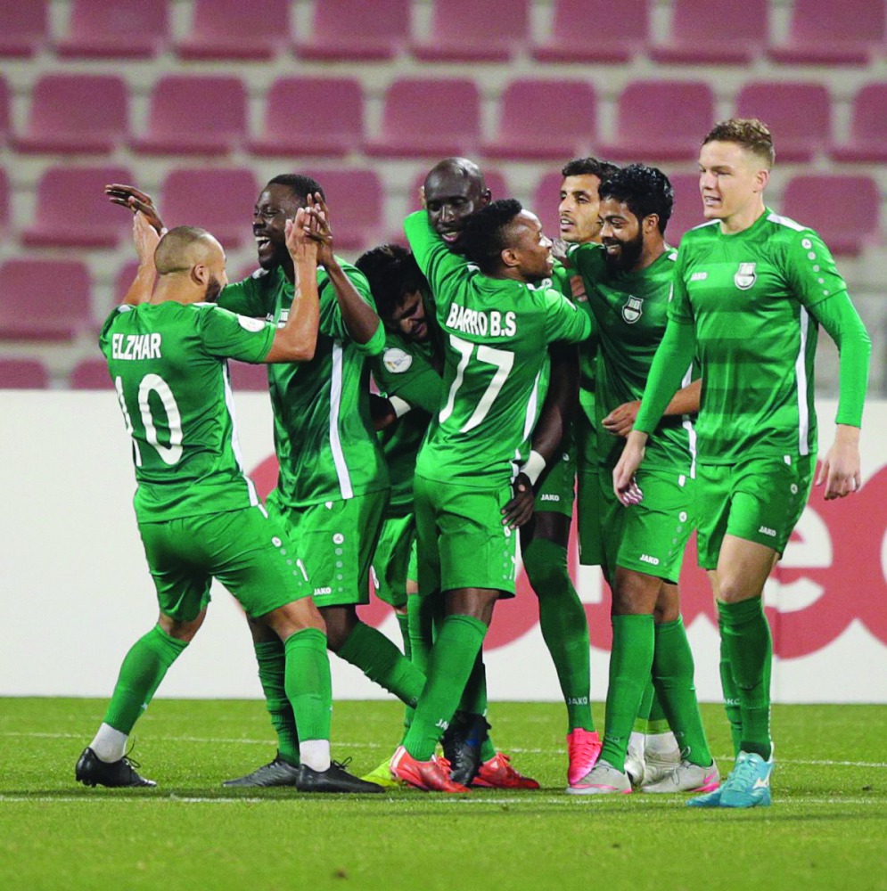 Al Ahli players celebrate after defeating Qatar SC in their Amir Cup pre-quarter-final match played at the Grand Hamad Stadium in Doha, yesterday. Al Ahli won 2-1.