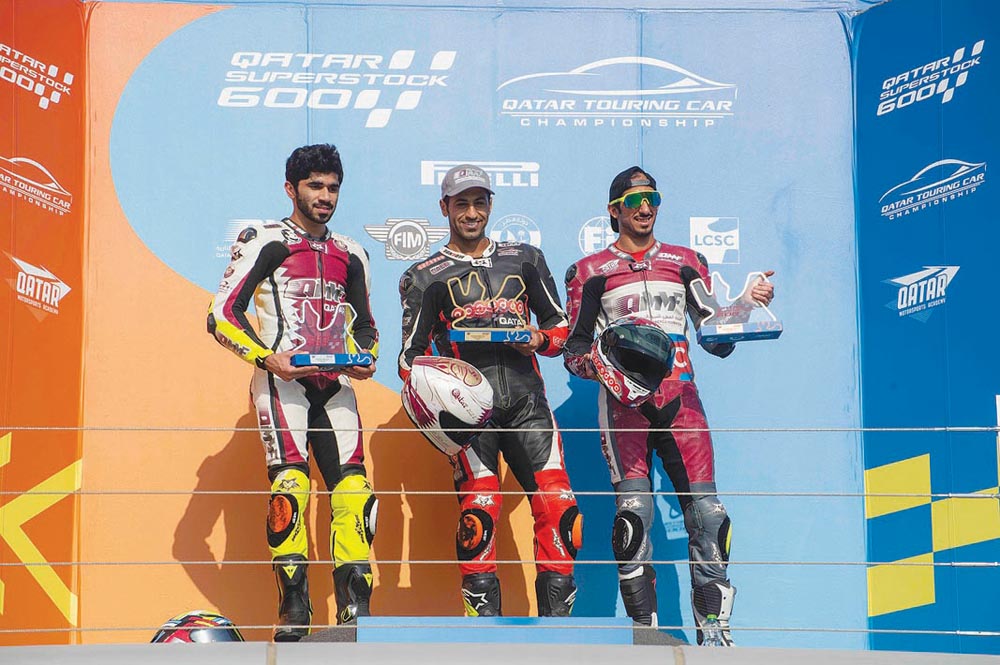 Saeed Al Sulaiti (centre), Abdulla Al Qubaisi (left) and Mishal Al Naimi at the presentation ceremony during the 4th Round of Qatar Superstock 600 at Losail International Circuit.