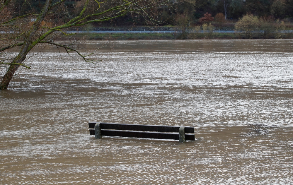 A park bench is flooded by the river Moselle due to heavy rainfalls in western Europe in Winning near Koblenz, Germany, February 4, 2020. REUTERS/Wolfgang Rattay