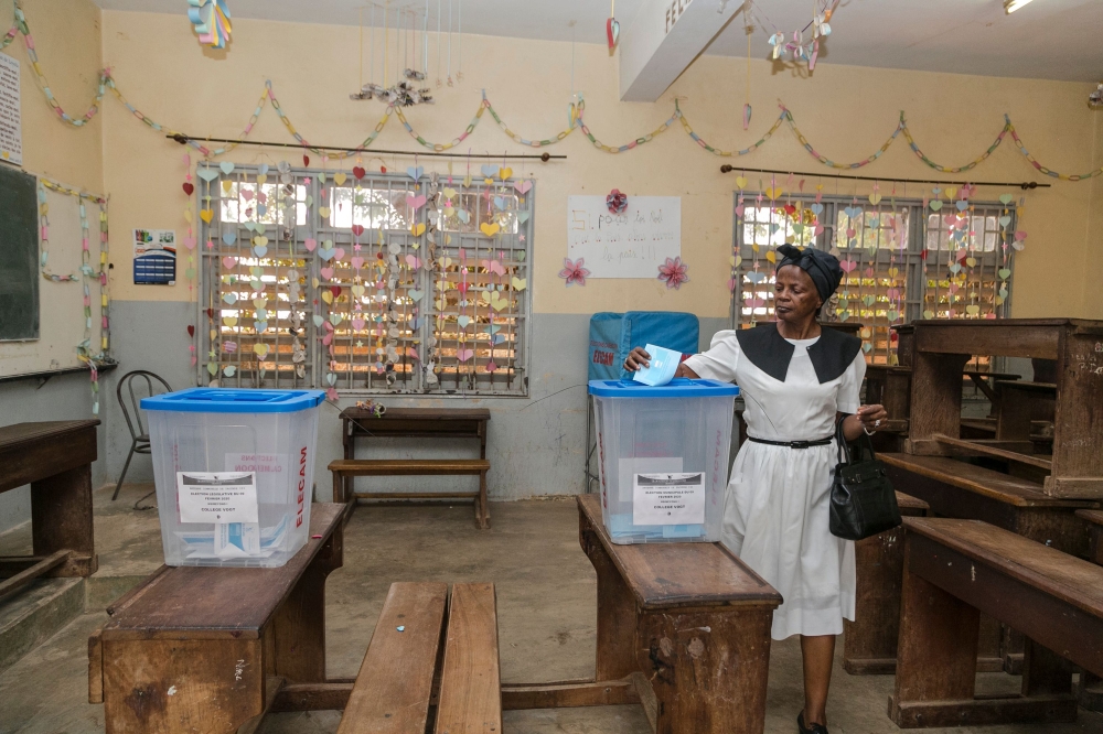 A woman casts her ballot during the general and municipal elections in Yaounde on February 9, 2020. AFP 