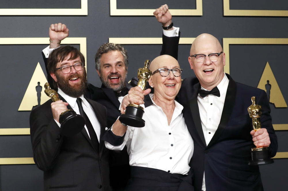 Steven Bognar, Julia Reichert and Jeff Reichert pose with the Oscar for Best Documentary Feature for 
