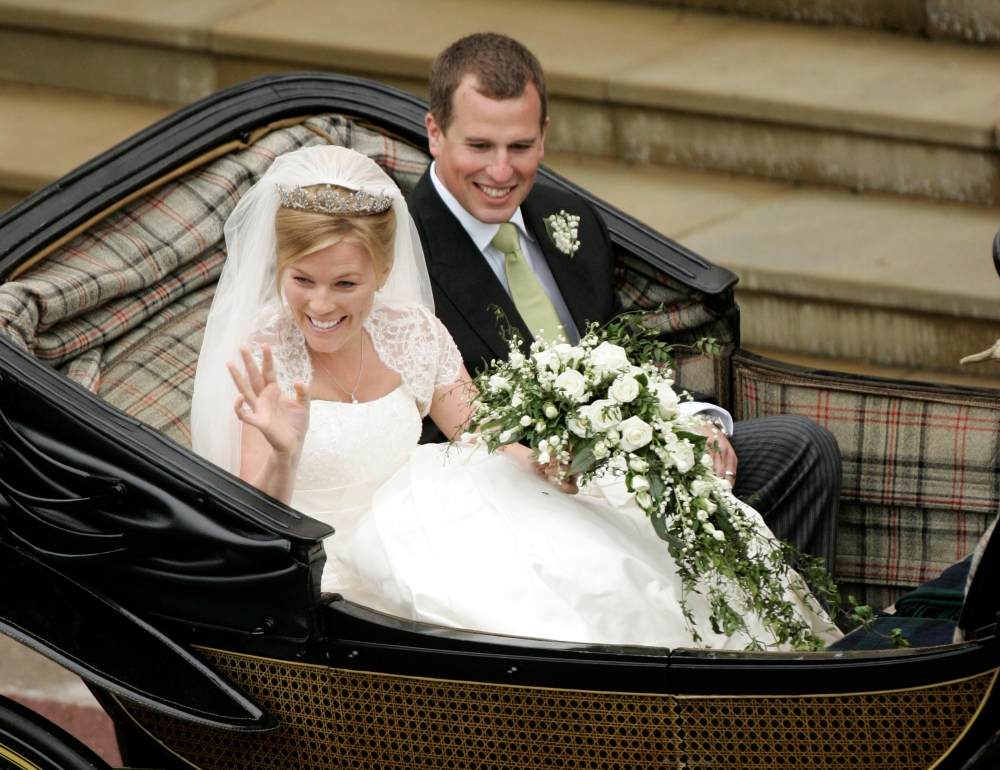 Britain's Peter Phillips (R) and Canada's Autumn Kelly leave St George's Chapel after their marriage in Windsor, southern England on May 17, 2008. REUTERS/Sang Tan/Pool/File Photo