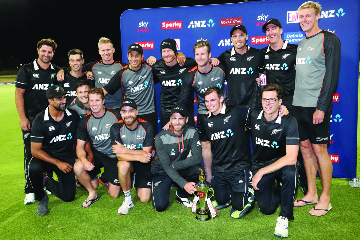 New Zealand’s players celebrate with the trophy after victory during the third one-day international cricket match between New Zealand and India at the Bay Oval in Mount Maunganui on February 11, 2020. AFP / Michael Bradley
