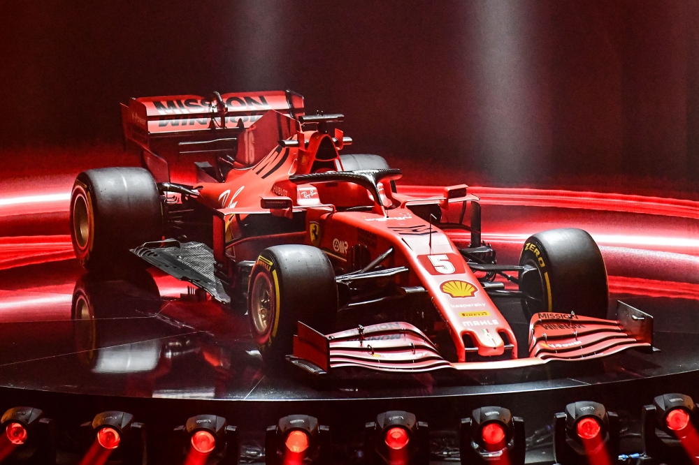 This photo taken and handout by the Ferrari Press Office on February 11, 2020 shows the new Ferrari Formula One SF1000 during its unveiling ceremony at Teatro Romolo-Valli in Reggio Emilia. AFP / FERRARI PRESS OFFICE 
