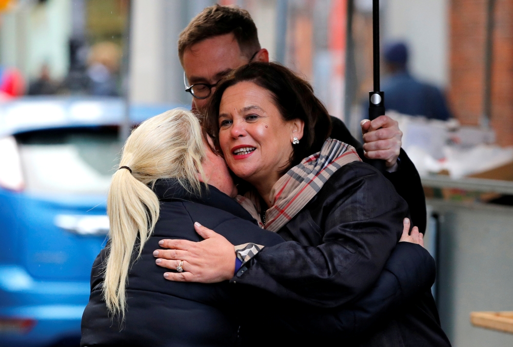 Sinn Fein leader Mary Lou McDonald hugs a member of the public in Dublin, Ireland, February 10, 2020. REUTERS/Phil Noble
