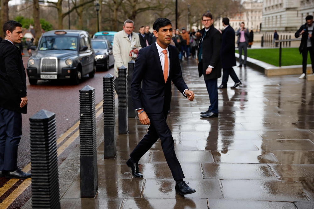 Britain's newly appointed Chancellor of the Exchequer Rishi Sunak arrives at the Treasury in central London on February 13, 2020 after recieving his new appointment. Britain's prime minister revamped his top team on February 13 in his first cabinet reshuf