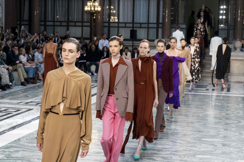 Models present creations from designer Victoria Beckham during the Spring Summer 2020 collection on the third day of London Fashion Week on September 15, 2019. AFP / Niklas Halle'n