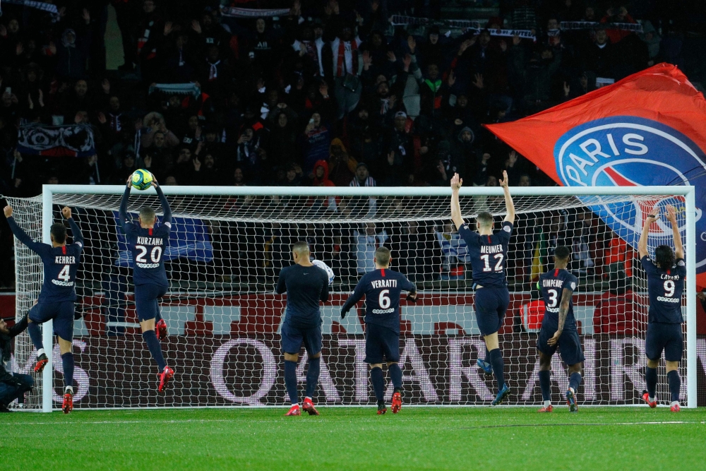 Paris Saint-Germain's celebrate their 4-2 win against Lyon in their French L1 football match Paris Saint-Germain (PSG) against Lyon (OL) at the Parc des Princes stadium in Paris, on February 9, 2020. AFP / GEOFFROY VAN DER HASSELT