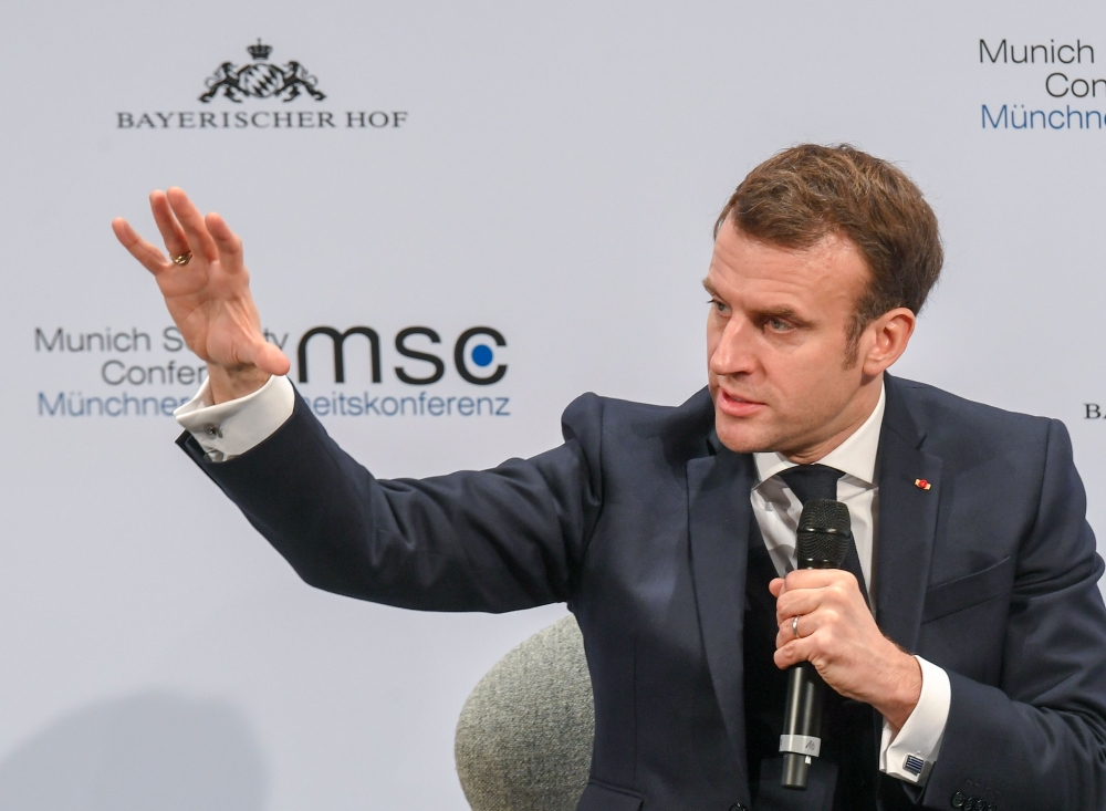 France's President Emmanuel Macron addresses the audience on the podium during the 56th Munich Security Conference (MSC) in Munich, southern Germany, on February 15, 2020.  AFP / Christof STACHE