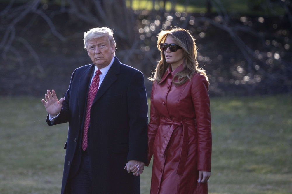 WASHINGTON, DC - FEBRUARY 14: U.S. President Donald Trump and First Lady Melania Trump walk to the south lawn heading to Palm Beach for the weekend on February 14, 2020 in Washington, DC. Tasos Katopodis/AFP