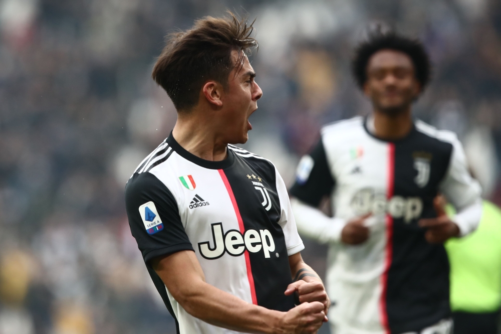 Juventus' Argentine forward Paulo Dybala celebrates after opening the scoring during the Italian Serie A football match Juventus vs Brescia on February 16, 2020 at the Juventus stadium in Turin. / AFP / Isabella BONOTTO