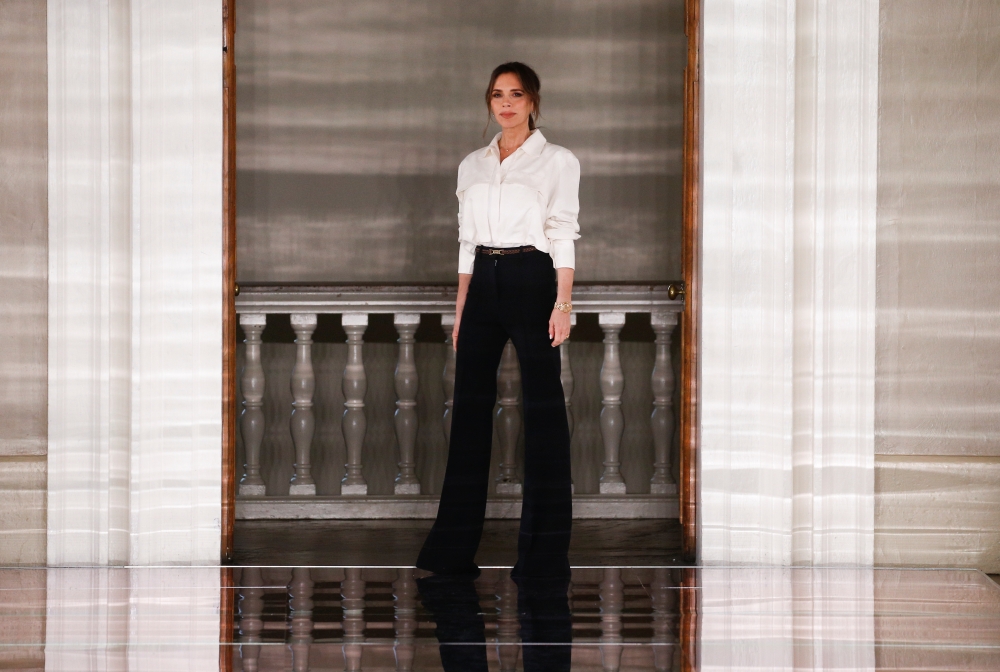 Designer Victoria Beckham at the end of her catwalk show during London Fashion Week in London, Britain, February 16, 2020. REUTERS/Henry Nicholls