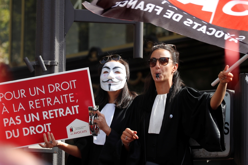 French lawyers attend a demonstration to protest against pension reforms in Paris, France, September 16, 2019. Reuters / Charles Platiau