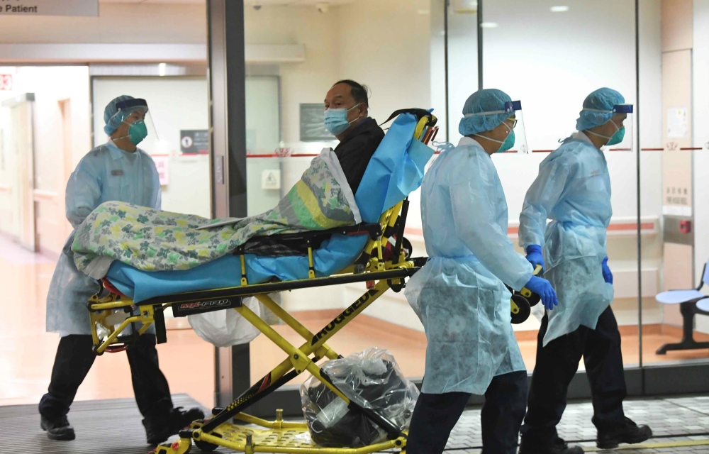 Medical staff transfer a patient of a suspected case of a new coronavirus at the Prince of Wales Hospital in Hong Kong, January 22, 2020. cnsphoto via Reuters