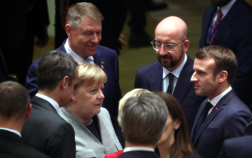 German Chancellor Angela Merkel, Romanian President Klaus Iohannis, European Council President Charles Michel and France's President Emmanuel Macron attend the second day of the European Union leaders summit, held to discuss the EU's long-term budget for 