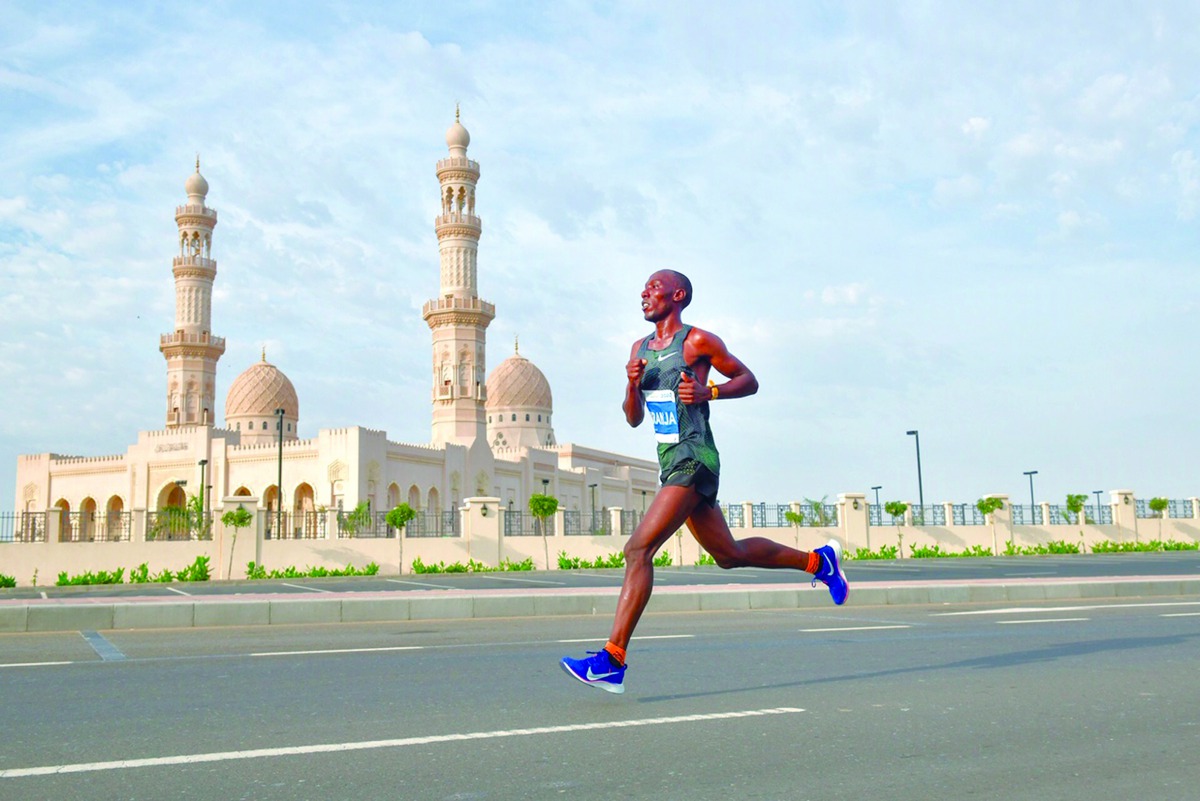 Kenya’s Pius Karanja on his way to win the 2020 Al Mouj Muscat Marathon, yesterday.