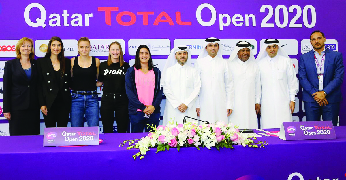 Players and officials posing for a photograph following the Qatar Total Open 2020 draw ceremony.