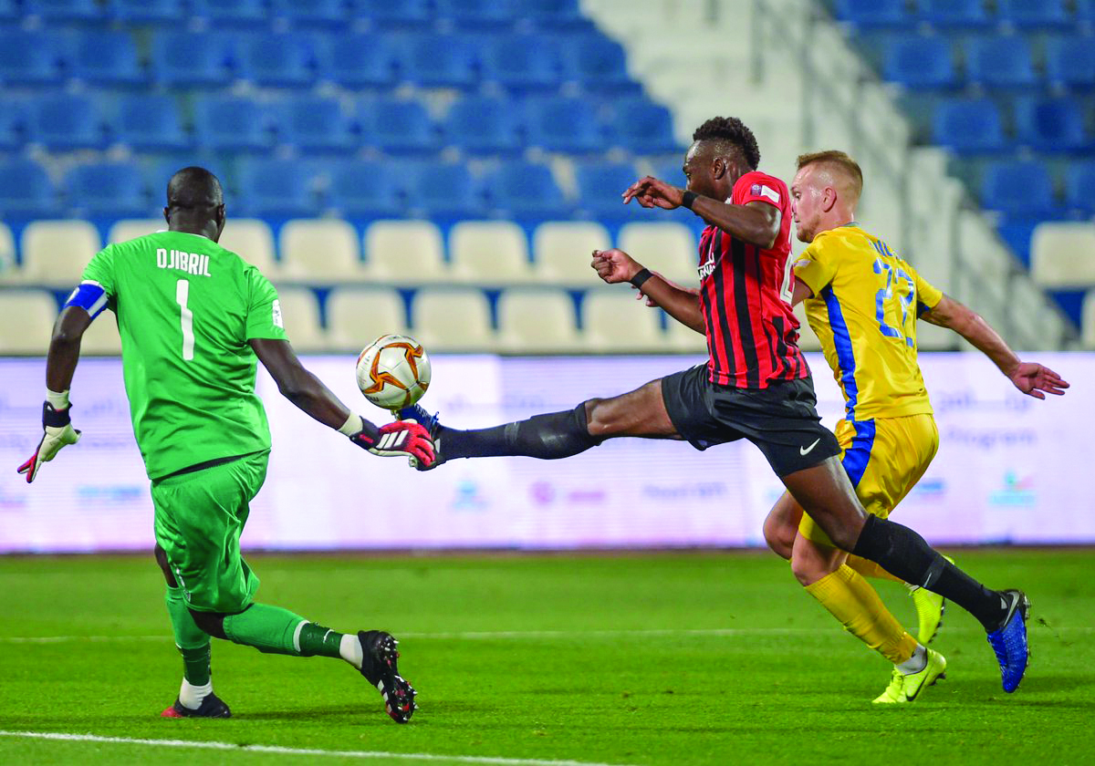 Al Rayyan's Yohan Boli (centre) controls the ball during yesterday's match. 