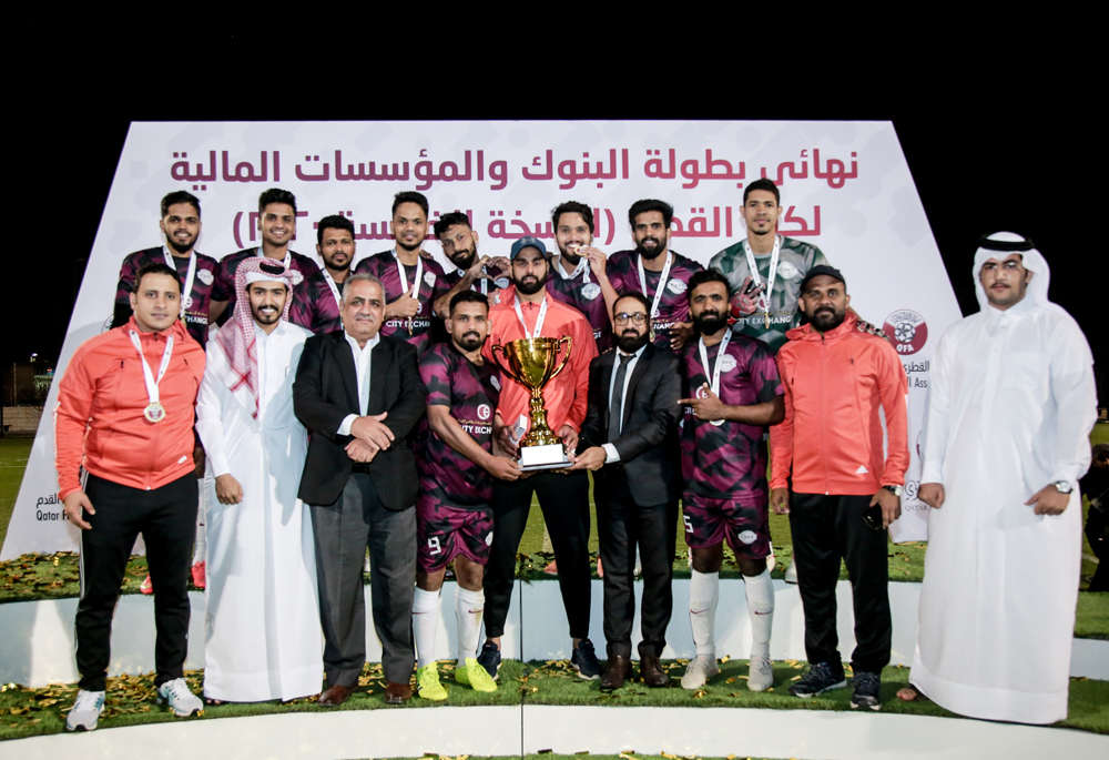 City Exchange football team with the trophy after winning the title of the fifth edition of Banks Sevens Football Tournament for banks and financial institutions. 