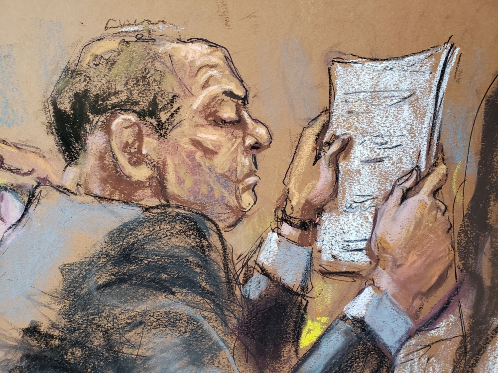 Harvey Weinstein sits at the defense table reading papers during jury deliberations in his sexual assault trial in the Manhattan borough of New York City, New York, US, February 24, 2020 in this courtroom sketch. Reuters/Jane Rosenberg
 