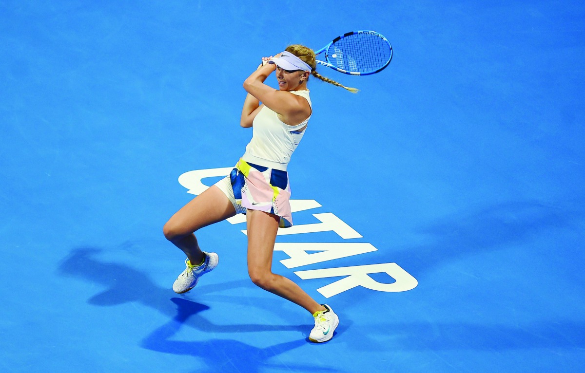 Amanda Anisimova of the US returns the ball to Elina Svitolina of Ukraine during their Round of 32 match of the Qatar Total Open at the Khalifa International Tennis and Squash Complex, yesterday.