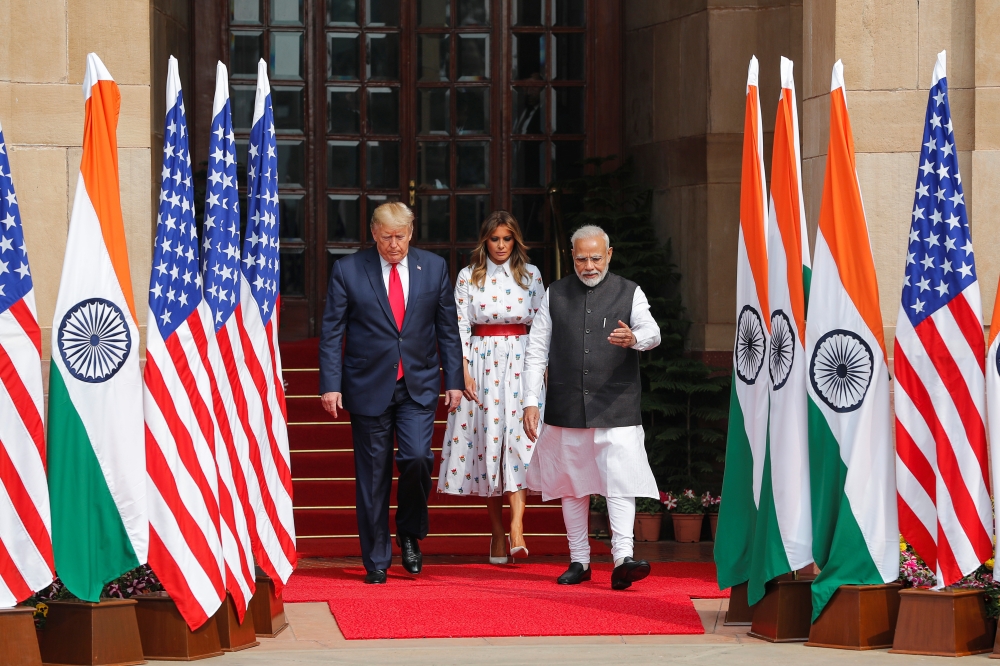 U.S. President Donald Trump, first lady Melania Trump and India's Prime Minister Narendra Modi walk ahead of their meeting at Hyderabad House in New Delhi, India, February 25, 2020. REUTERS/Adnan Abidi