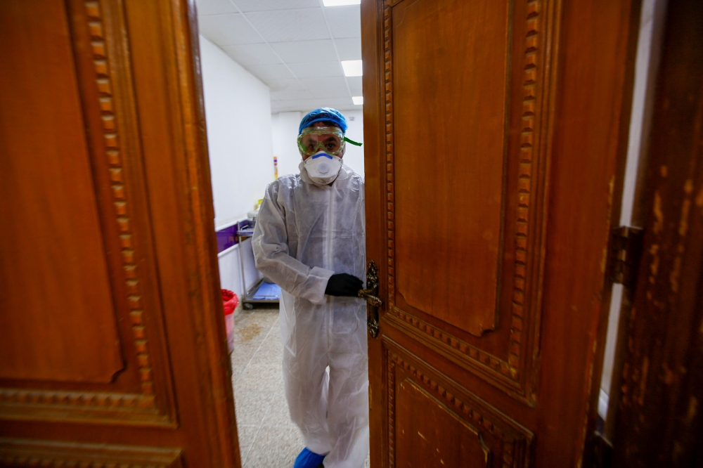 A member of medical staff is seen at a quarantine room of a hospital, following the outbreak of the new coronavirus, in the holy city of Najaf, Iraq February 24, 2020. REUTERS/Alaa al-Marjani