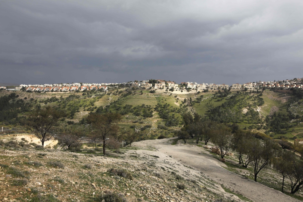 A picture taken from the E1 corridor, a super-sensitive area of the occupied West Bank, shows Israeli settlement of Maale Adumin in the background on February 25, 2020. AFP / Menahem Kahana
 