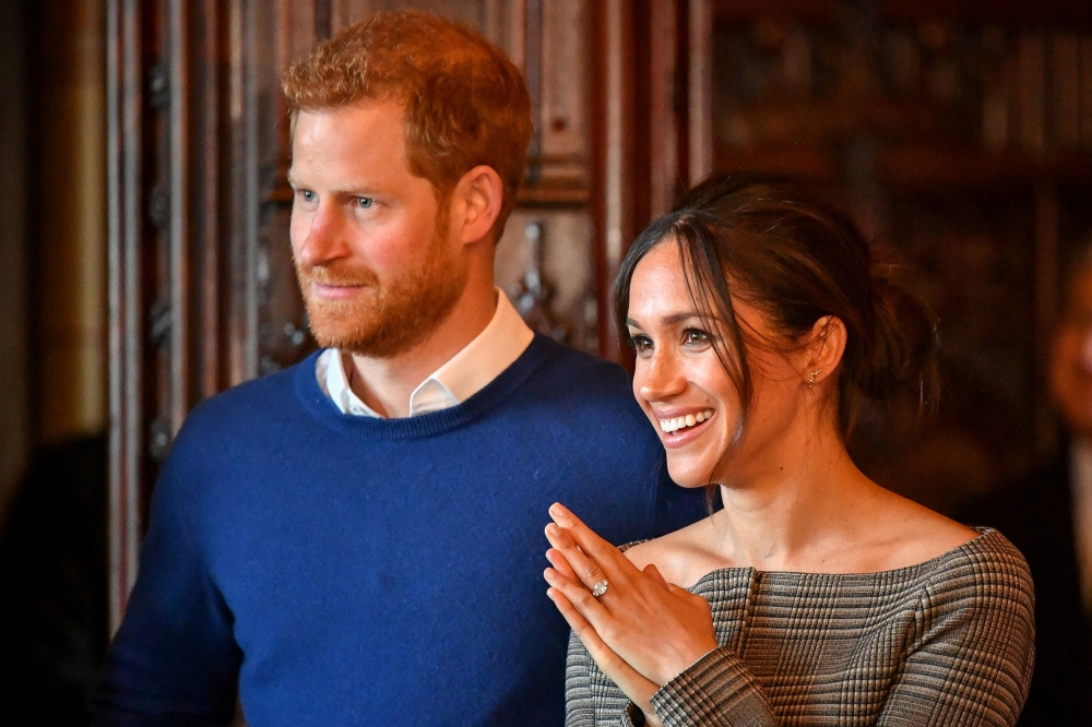 Prince Harry and Meghan Markle watch a performance by a Welsh choir in the banqueting hall during a visit to Cardiff Castle, Britain, January 18, 2018. Reuters / Ben Birchall