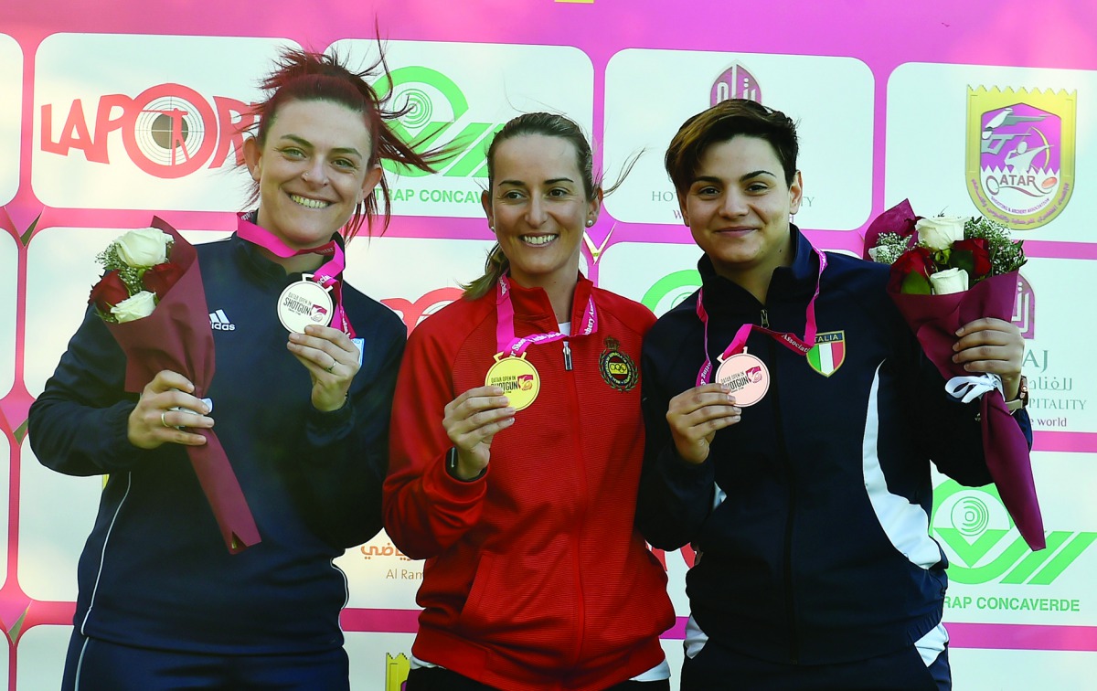 The podium winners in the men's and women's Trap finals of the Qatar Open Shotgun Championship at the Losail Shooting Range posing for photographs yesterday. Pictures: Syed Omar