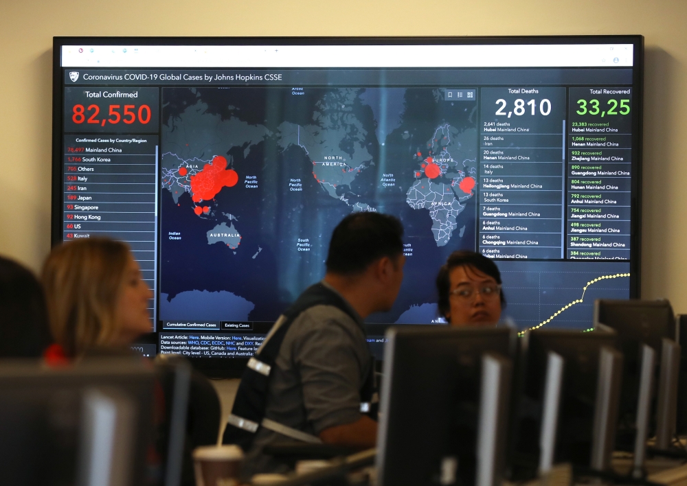 SACRAMENTO, CALIFORNIA - FEBRUARY 27: A video monitor inside the Medical Health and Coordination Center at the California Department of Public Health shows the number of Coronavirus COVID-19 cases around the world on February 27, 2020 in Sacramento, Calif