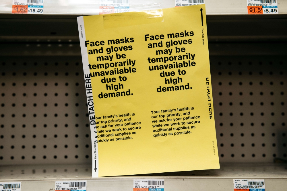 NEW YORK, NY - FEBRUARY 26: Amidst fears of a growing Coronoavirus pandemic, signs for sold out facemasks are posted in a Manhattan pharmacy on February 26, 2020 in New York City. Scott Heins/AFP