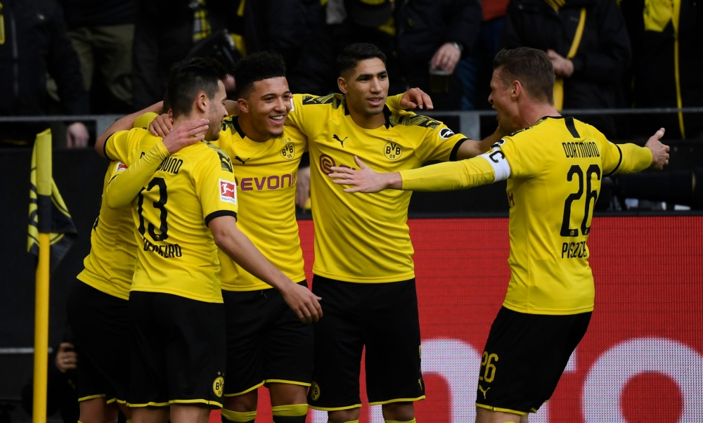 Dortmund's players celebrate a goal during the German first division Bundesliga football match Borussia Dortmund v SC Freiburg on February 29, 2020 in Dortmund. 