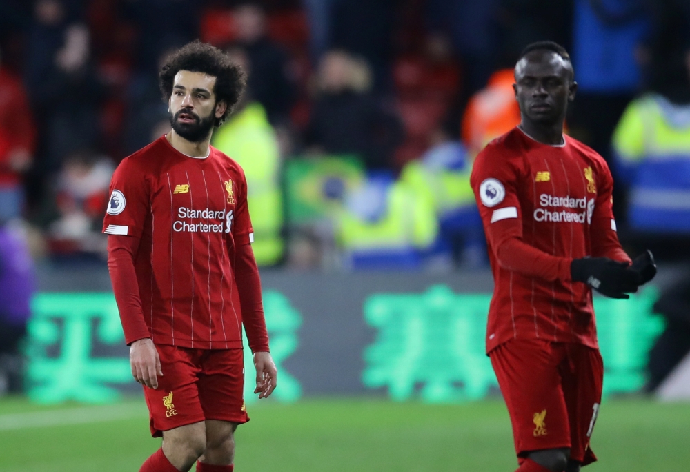 Liverpool's Sadio Mane and Mohamed Salah look dejected at the end of the match REUTERS/David Klein 