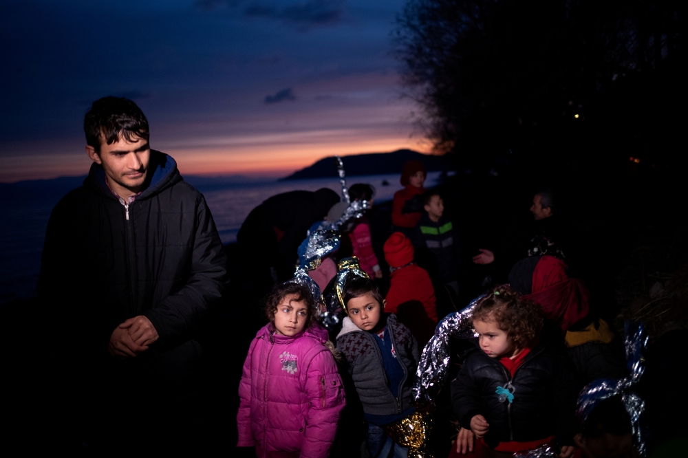 Migrants from Afghanistan are seen on a beach near the village of Skala Sikamias, after crossing part of the Aegean Sea from Turkey to the island of Lesbos, Greece, March 1, 2020. Reuters/Alkis Konstantinidis