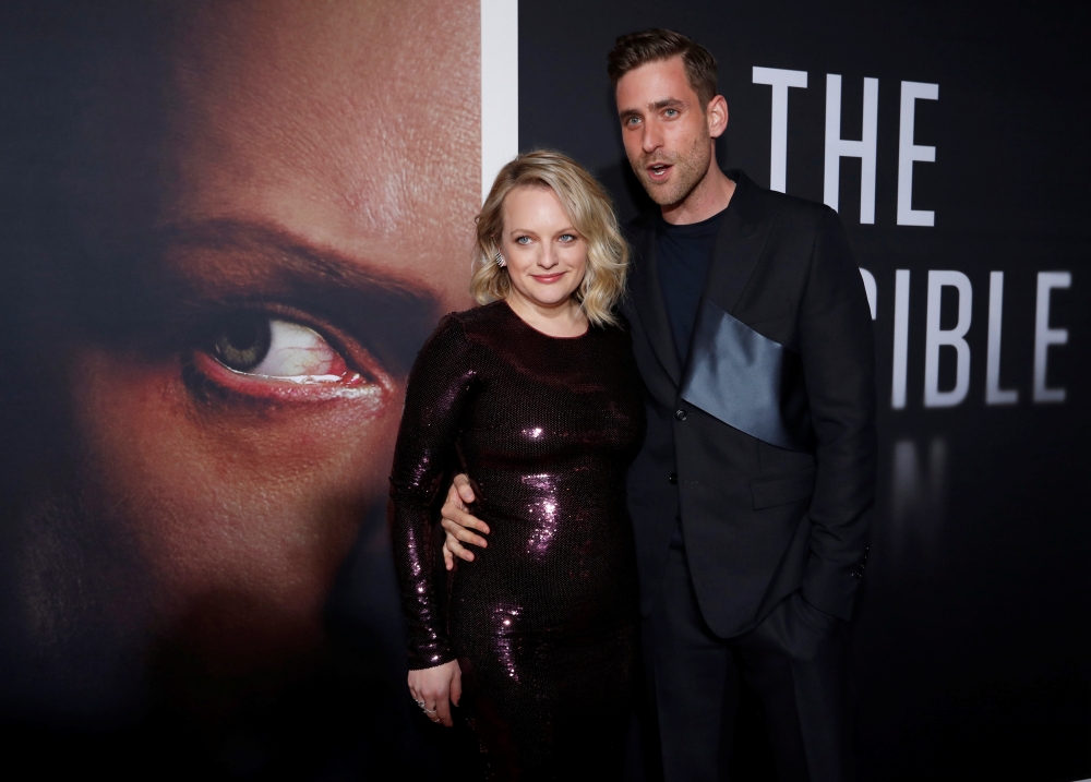 Cast members Elisabeth Moss and Oliver Jackson-Cohen attend the premiere for the film 