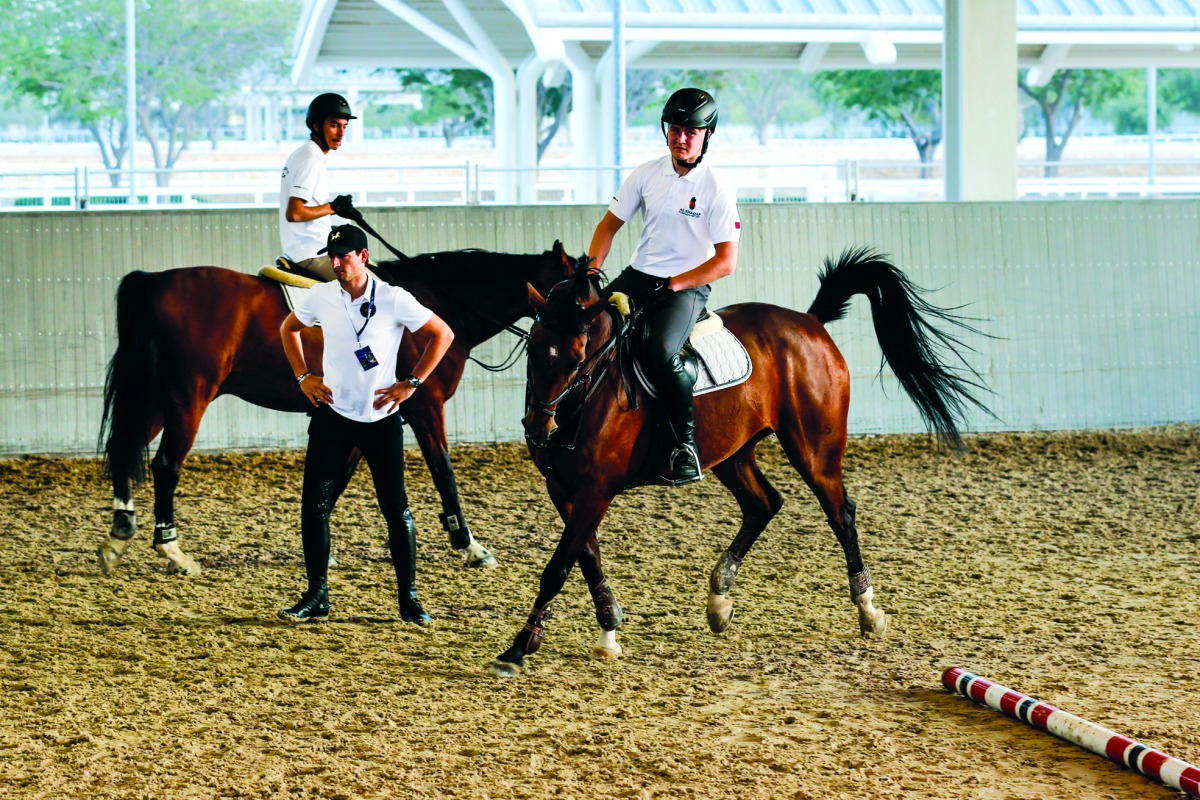 Belgian rider Nicola Philippaerts (centre) offers tips to young riders during the Internations Camp at Al Shaqab, yesterday.