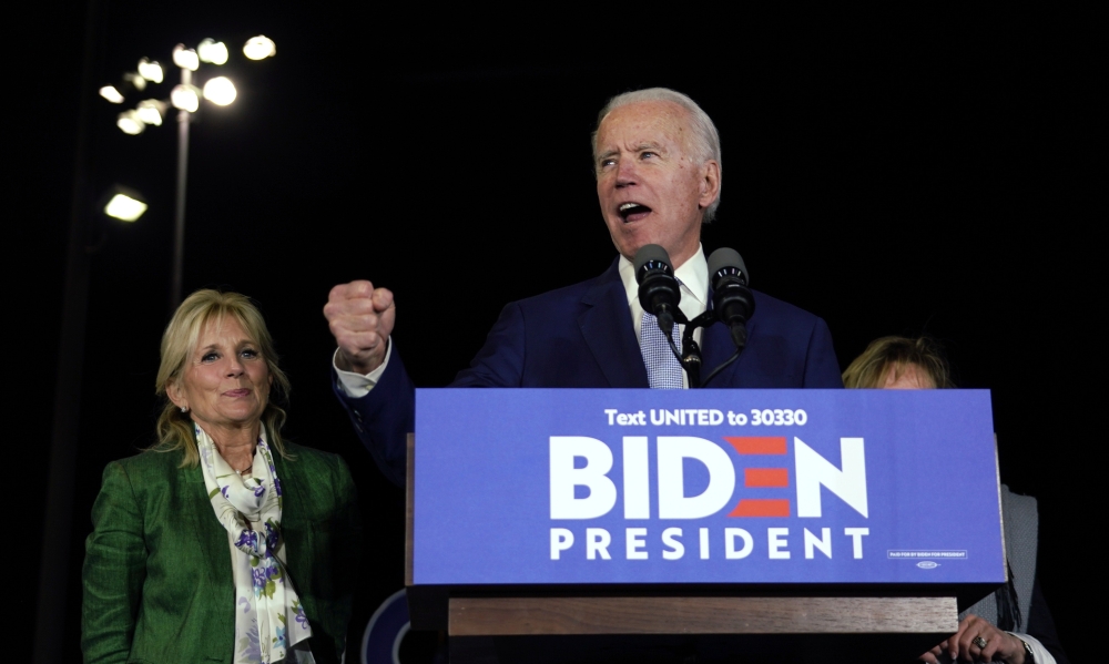 Democratic U.S. presidential candidate and former Vice President Joe Biden addresses supporters with his wife Jill at his side during his Super Tuesday night rally in Los Angeles, California, U.S., March 3, 2020. Reuters/Kyle Grillot
