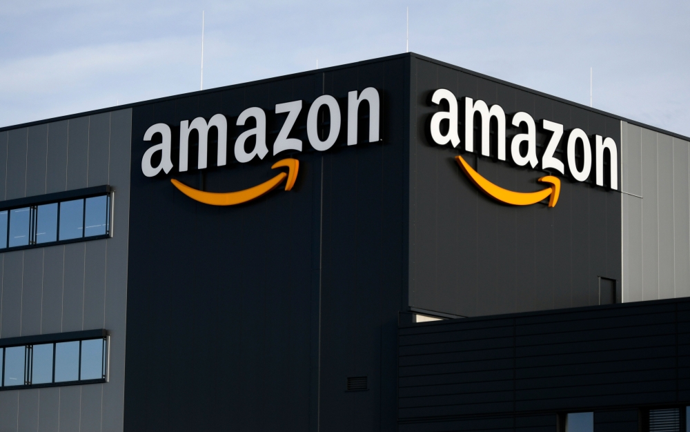 (FILES) In this file photo taken on December 17, 2019 This picture shows the logo of US online retail giant Amazon at the distribution centre in Moenchengladbach, western Germany./ AFP / INA FASSBENDER

